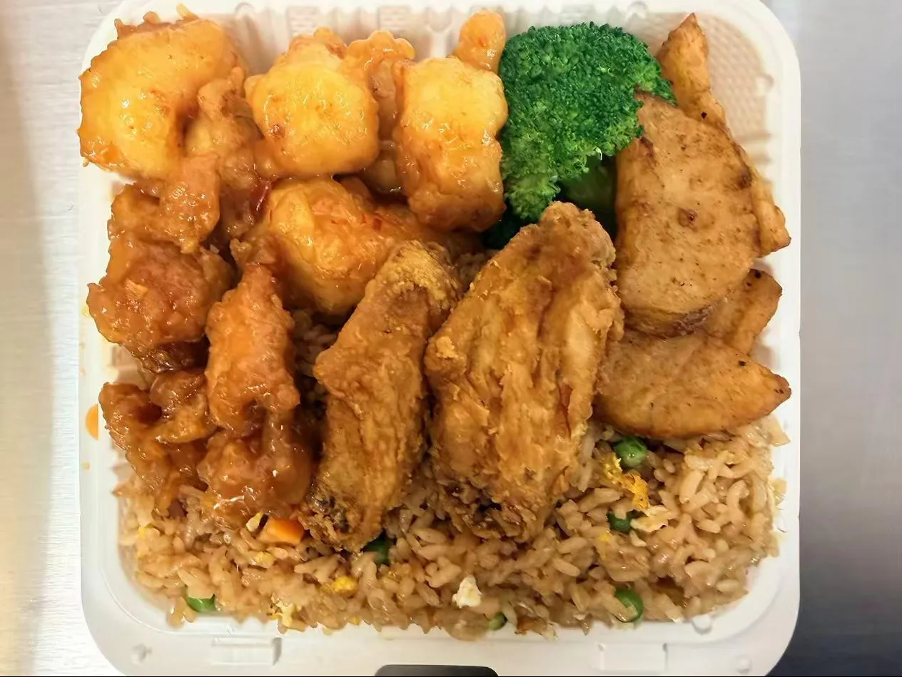 Combination takeout box with fried shrimp, chicken, fried rice and broccoli at Sam Bistro Thai Restaurant in Middletown