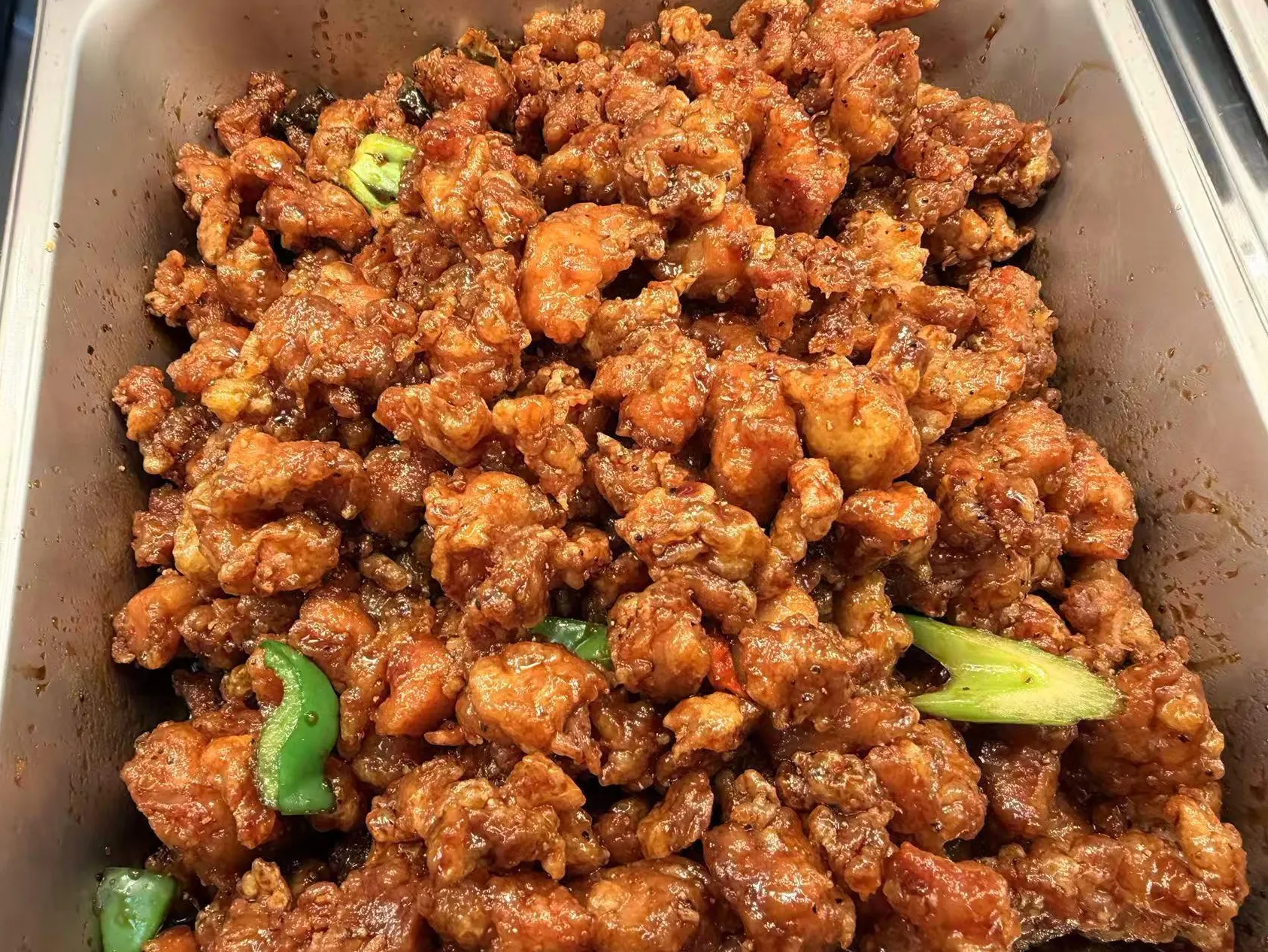 Glazed pepper fried chicken chunks mixed with green bell pepper strips at Sam Bistro Thai Restaurant in Middletown